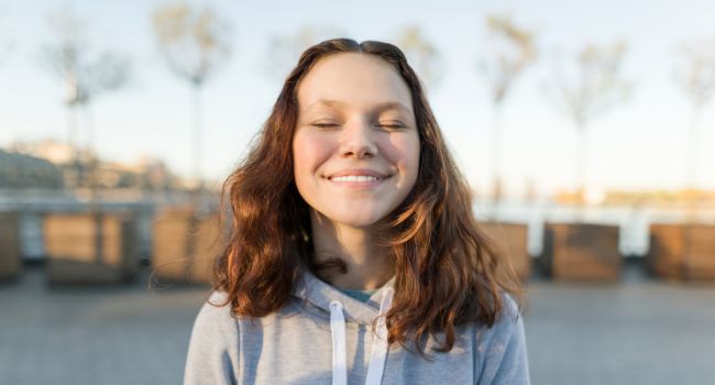 an image of a teen using mindfulness to help with trauma