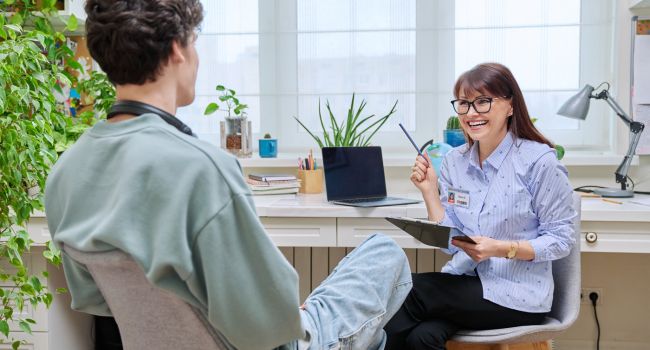 a teen learning about the risk factors of teen depression