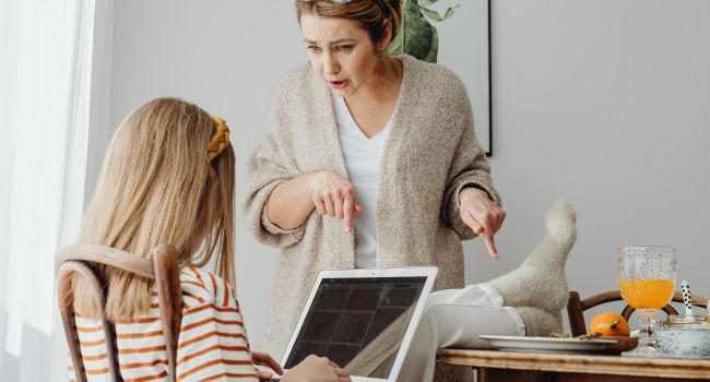 Parent and teen in a tense moment, with the parent expressing frustration and the teen appearing disengaged, illustrating common authority problems faced by teens and the challenges for parents.