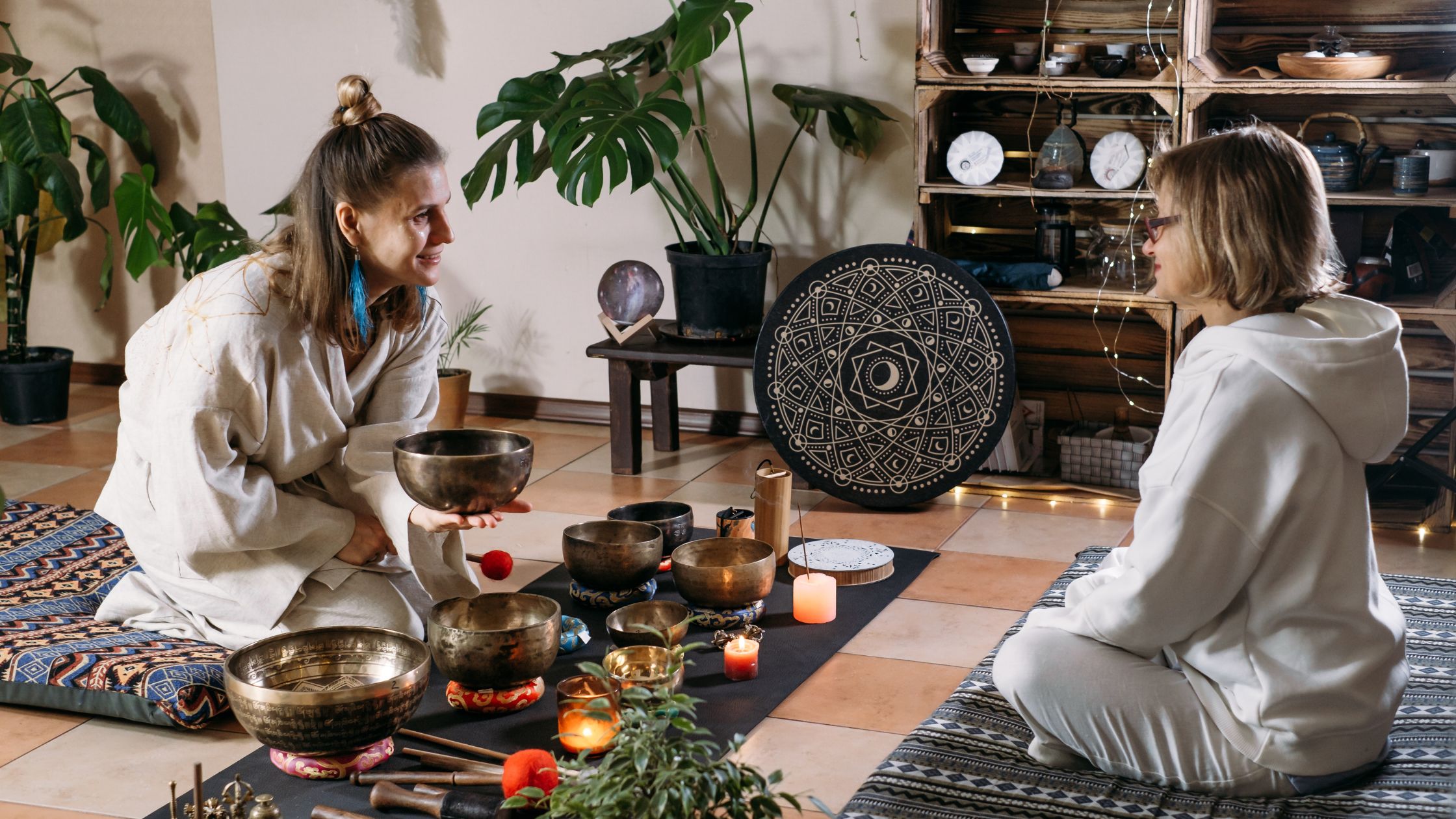 Therapist guiding a teen through a sound healing session using Tibetan singing bowls in a calming space, supporting mental health treatment at Nexus Teen Academy.