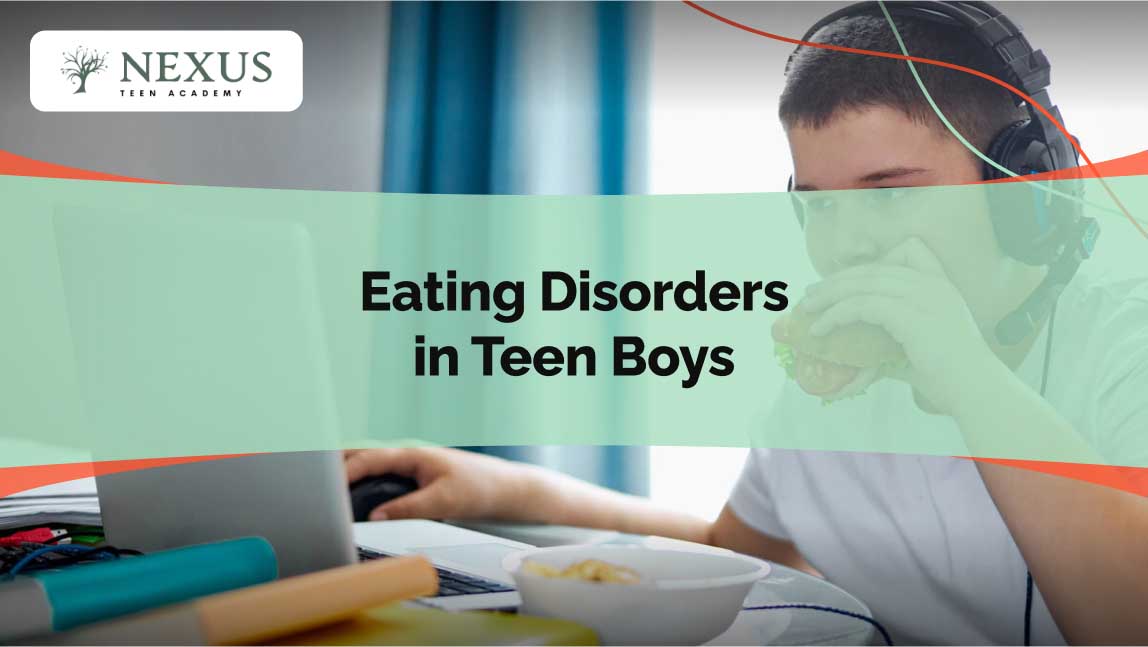 Teen boy wearing headphones eats a sandwich while gaming at his desk, highlighting eating disorders in teen boys.
