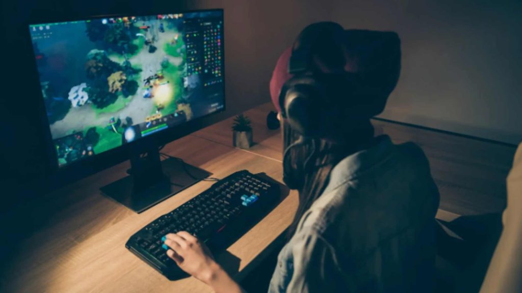 Teen boy gaming alone, reflecting patterns of excessive play and early signs of video game addiction in teenage boys.