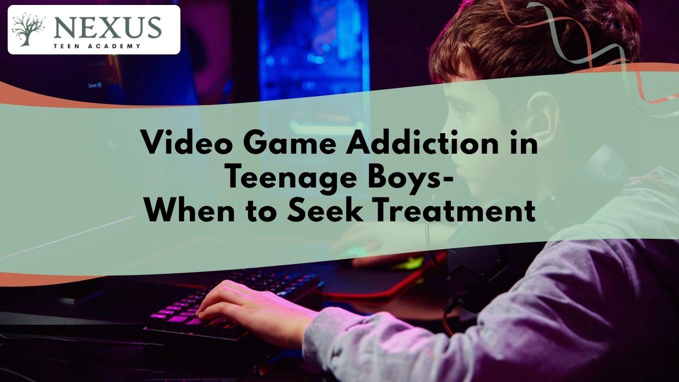 Teen boy gaming at his computer, signaling concerns about video game addiction and when treatment support may be necessary.